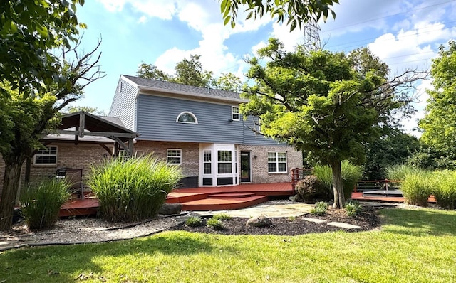6330 Branch Hill Miamiville Rd, Miami Twp, OH 45140 - rear view of house with brick siding, a wooden deck, and a lawn