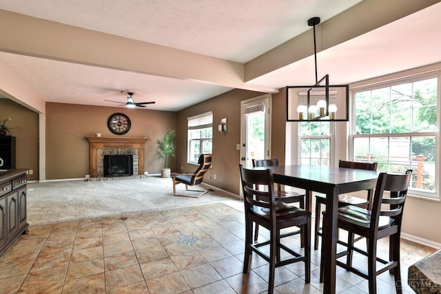 6330 Branch Hill Miamiville Rd, Miami Twp, OH 45140 - dining space with ceiling fan, a fireplace, light colored carpet, and a textured ceiling