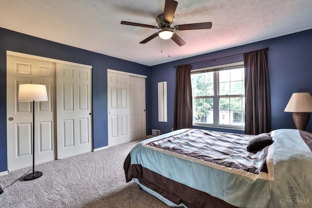 6330 Branch Hill Miamiville Rd, Miami Twp, OH 45140 - bedroom featuring two closets, carpet flooring, and ceiling fan