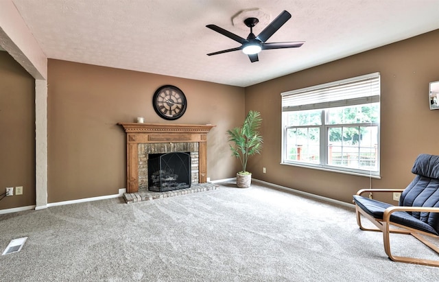 6330 Branch Hill Miamiville Rd, Miami Twp, OH 45140 - living area with carpet, a brick fireplace, a ceiling fan, and a textured ceiling