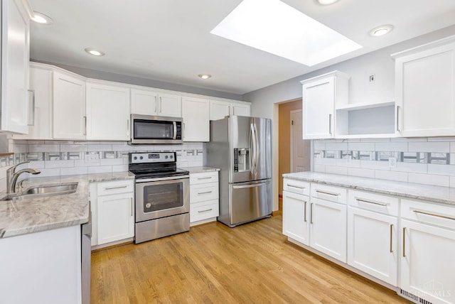 3324 Moonridge Dr, Green Twp, OH 45248 - kitchen featuring appliances with stainless steel finishes, open shelves, white cabinetry, backsplash, and recessed lighting