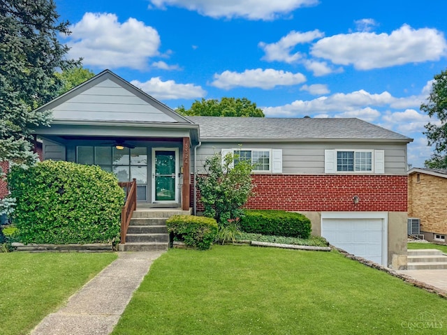 3324 Moonridge Dr, Green Twp, OH 45248 - view of front of property with a front yard, brick siding, an attached garage, ceiling fan, and driveway