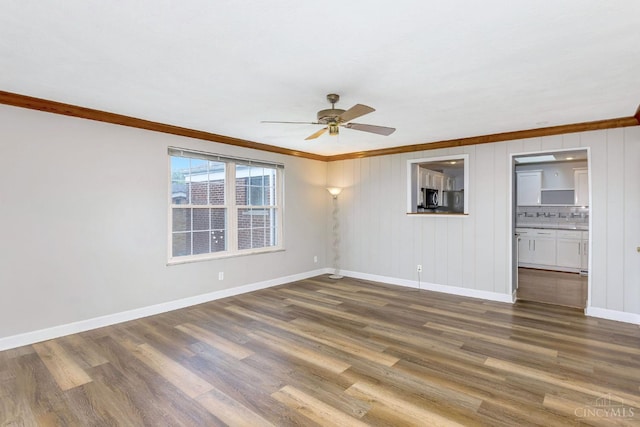 3324 Moonridge Dr, Green Twp, OH 45248 - empty room featuring ornamental molding, ceiling fan, and dark wood finished floors