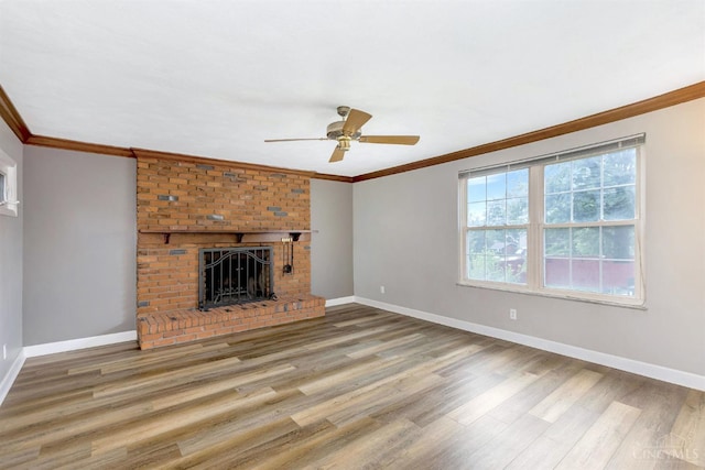 3324 Moonridge Dr, Green Twp, OH 45248 - unfurnished living room with wood finished floors, ceiling fan, ornamental molding, and a fireplace