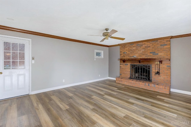 3324 Moonridge Dr, Green Twp, OH 45248 - unfurnished living room featuring ceiling fan, a brick fireplace, wood finished floors, and ornamental molding