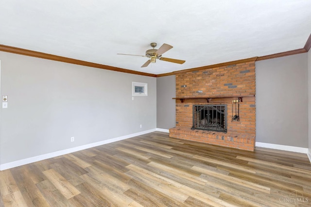 3324 Moonridge Dr, Green Twp, OH 45248 - unfurnished living room featuring ceiling fan, wood finished floors, ornamental molding, and a brick fireplace