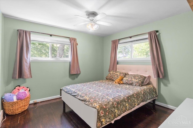 281 Compton Rd, Wyoming, OH 45215 - bedroom with dark wood-type flooring, multiple windows, and ceiling fan