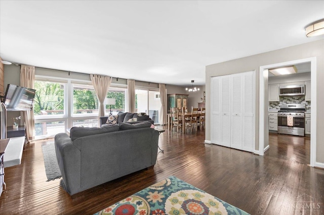 281 Compton Rd, Wyoming, OH 45215 - living room with dark wood-style flooring and a chandelier