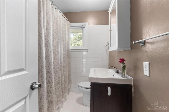 281 Compton Rd, Wyoming, OH 45215 - full bathroom featuring vanity, tile walls, and a shower with shower curtain