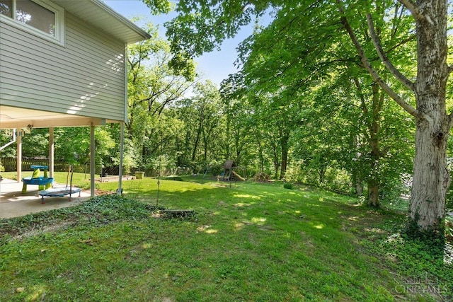 281 Compton Rd, Wyoming, OH 45215 - view of green lawn featuring a patio area and a playground