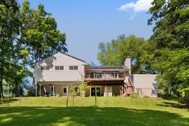 281 Compton Rd, Wyoming, OH 45215 - rear view of property featuring stairs, a deck, roof mounted solar panels, and a yard