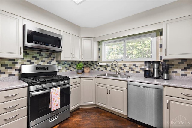 281 Compton Rd, Wyoming, OH 45215 - kitchen with appliances with stainless steel finishes, white cabinets, decorative backsplash, and light countertops