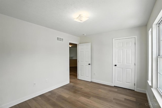 2380 Oaktree Pl, Cincinnati, OH 45238 - unfurnished bedroom with wood finished floors and baseboards