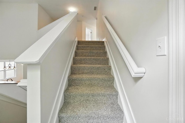 2380 Oaktree Pl, Cincinnati, OH 45238 - stairway featuring a chandelier and baseboards