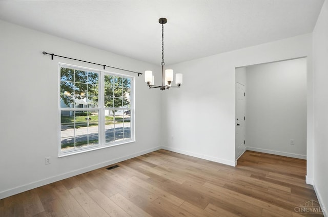 2380 Oaktree Pl, Cincinnati, OH 45238 - unfurnished dining area featuring a chandelier and light wood-style floors