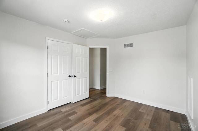 2380 Oaktree Pl, Cincinnati, OH 45238 - unfurnished bedroom featuring wood finished floors, a closet, and attic access