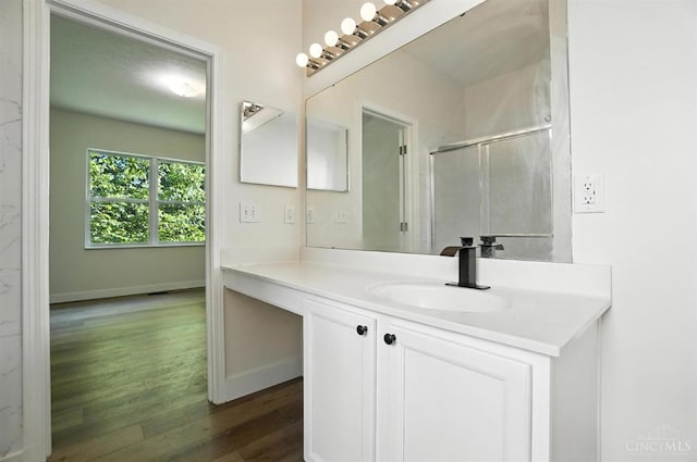 2380 Oaktree Pl, Cincinnati, OH 45238 - bathroom with wood finished floors, vanity, and a shower with shower door
