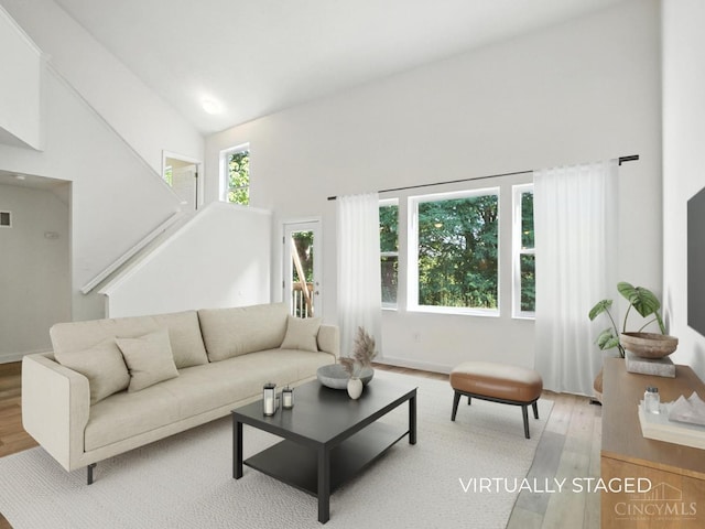2380 Oaktree Pl, Cincinnati, OH 45238 - living area featuring light wood-type flooring and a high ceiling