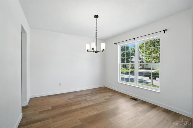 2380 Oaktree Pl, Cincinnati, OH 45238 - spare room with a chandelier and hardwood / wood-style flooring