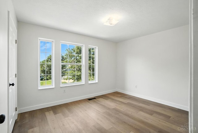 2380 Oaktree Pl, Cincinnati, OH 45238 - spare room with wood finished floors and a textured ceiling
