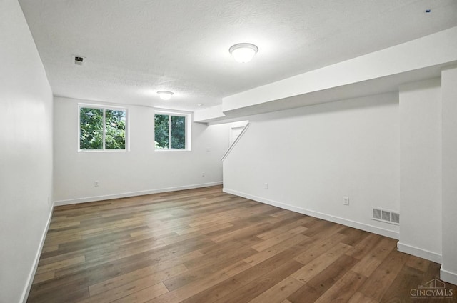 2380 Oaktree Pl, Cincinnati, OH 45238 - basement featuring wood-type flooring and a textured ceiling