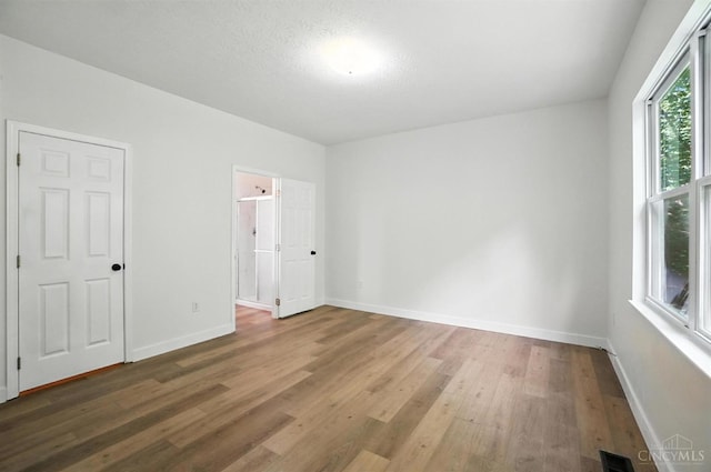 2380 Oaktree Pl, Cincinnati, OH 45238 - unfurnished bedroom featuring wood finished floors and baseboards