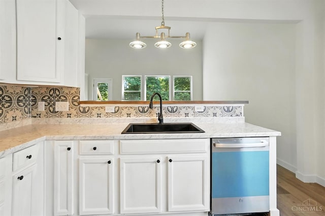 2380 Oaktree Pl, Cincinnati, OH 45238 - kitchen featuring dishwashing machine, tasteful backsplash, and white cabinets