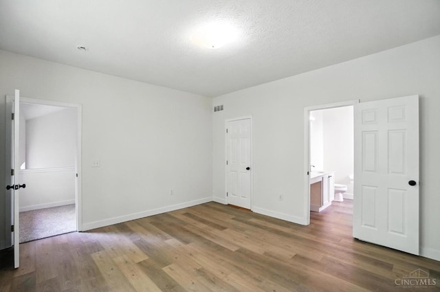 2380 Oaktree Pl, Cincinnati, OH 45238 - unfurnished bedroom featuring wood finished floors and ensuite bathroom