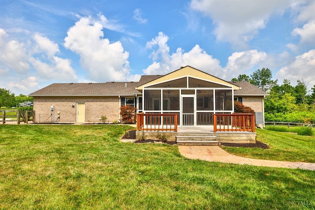 6154 Taylor Pike, Wayne Twp, OH 45107 - back of property featuring a sunroom, brick siding, and a shingled roof