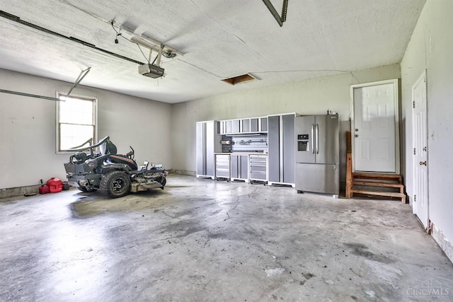 6154 Taylor Pike, Wayne Twp, OH 45107 - garage with stainless steel fridge and a garage door opener