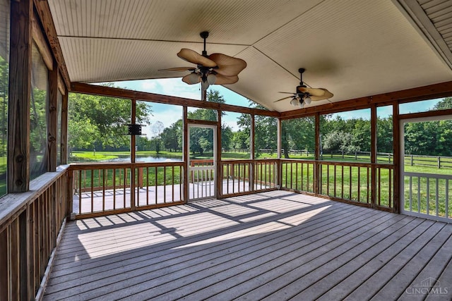 6154 Taylor Pike, Wayne Twp, OH 45107 - unfurnished sunroom featuring a water view, a ceiling fan, vaulted ceiling, view of wooded area, and plenty of natural light