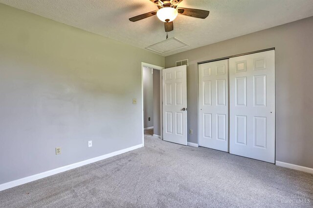6154 Taylor Pike, Wayne Twp, OH 45107 - unfurnished bedroom featuring a textured ceiling, carpet floors, a closet, and ceiling fan