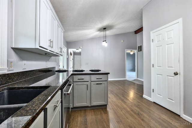 6154 Taylor Pike, Wayne Twp, OH 45107 - kitchen featuring a peninsula, dark wood-type flooring, white cabinetry, dark stone counters, and dishwasher
