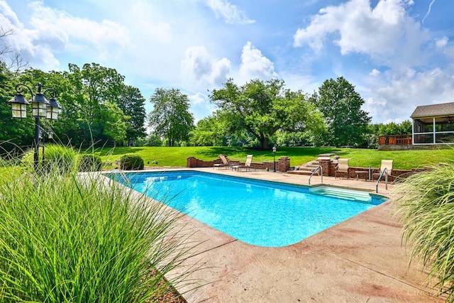 6154 Taylor Pike, Wayne Twp, OH 45107 - outdoor pool with a patio, a lawn, and view of wooded area