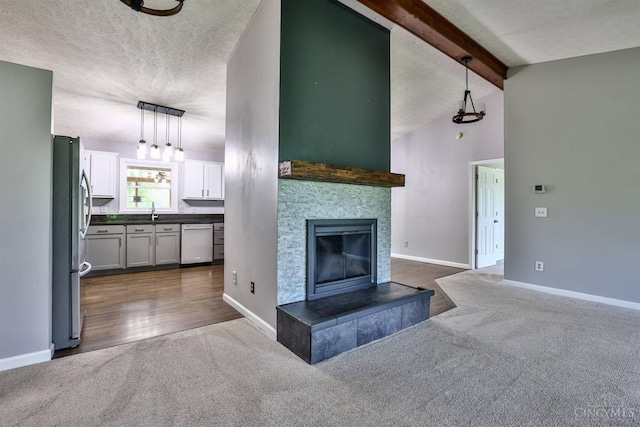 6154 Taylor Pike, Wayne Twp, OH 45107 - unfurnished living room featuring dark carpet, a tile fireplace, and a textured ceiling