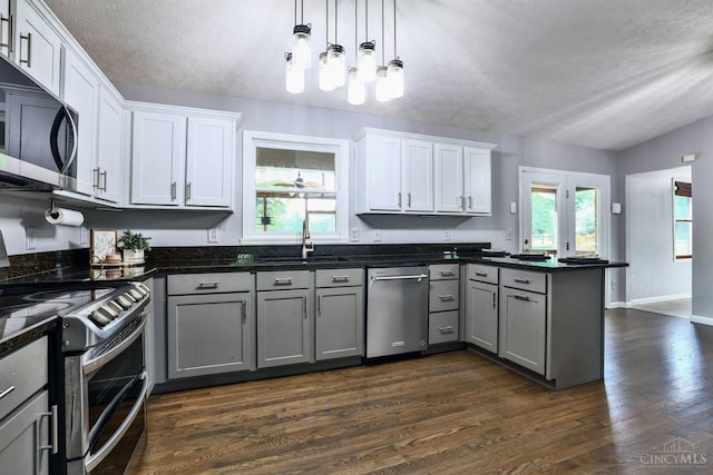 6154 Taylor Pike, Wayne Twp, OH 45107 - kitchen with appliances with stainless steel finishes, gray cabinets, a peninsula, dark wood-style floors, and a textured ceiling