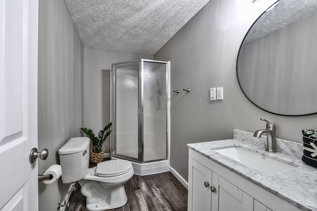 6154 Taylor Pike, Wayne Twp, OH 45107 - bathroom featuring a textured ceiling, vanity, a shower stall, and wood finished floors