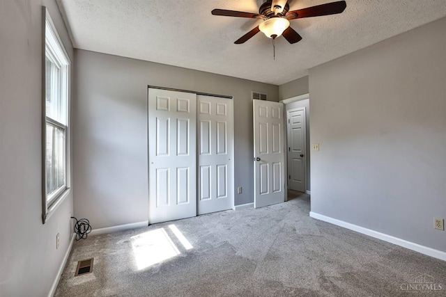 6154 Taylor Pike, Wayne Twp, OH 45107 - unfurnished bedroom featuring carpet, a textured ceiling, a closet, and ceiling fan