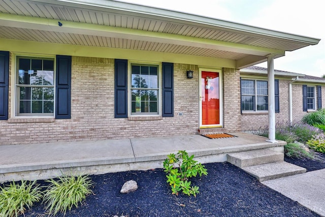 6154 Taylor Pike, Wayne Twp, OH 45107 - view of exterior entry featuring brick siding and a porch