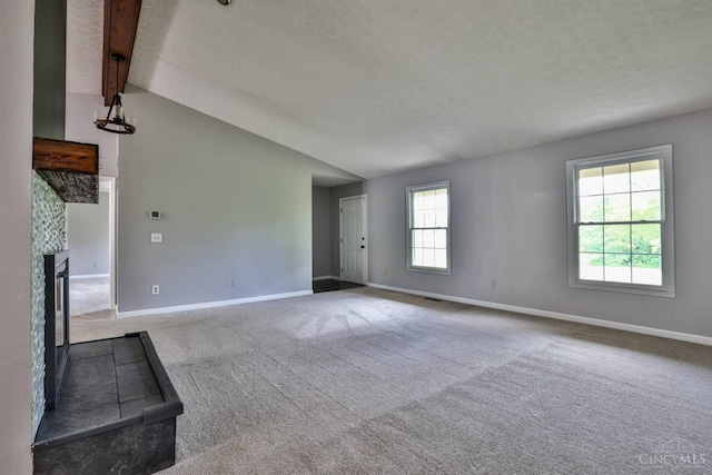 6154 Taylor Pike, Wayne Twp, OH 45107 - unfurnished living room featuring a textured ceiling, carpet floors, and a fireplace