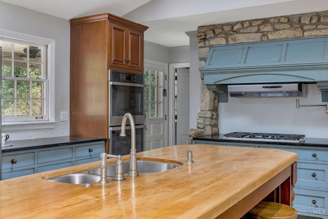 1050 Holz Ave, Anderson Twp, OH 45230 - kitchen with appliances with stainless steel finishes and wooden counters