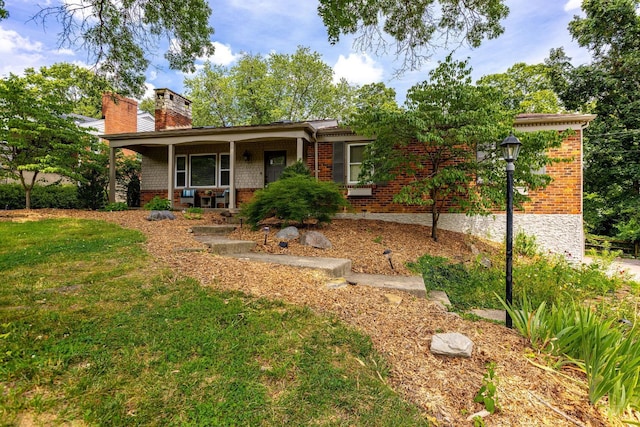 1050 Holz Ave, Anderson Twp, OH 45230 - ranch-style house featuring a porch, brick siding, a chimney, and a front lawn