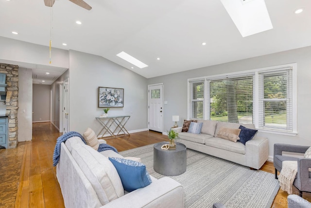 1050 Holz Ave, Anderson Twp, OH 45230 - living area with a skylight, plenty of natural light, lofted ceiling, wood finished floors, and recessed lighting