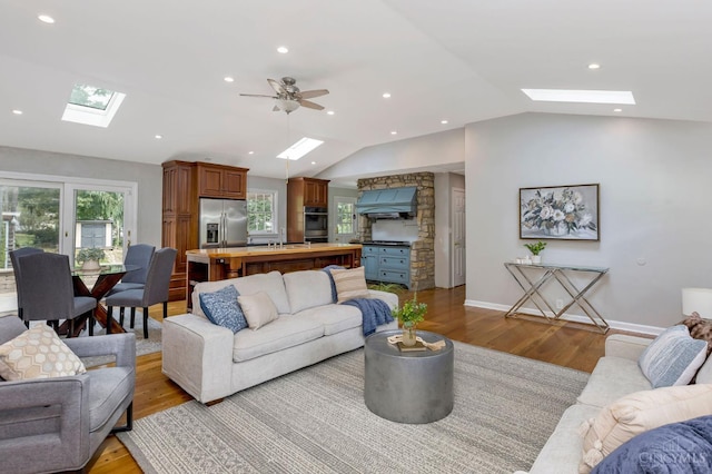 1050 Holz Ave, Anderson Twp, OH 45230 - living area with a skylight, vaulted ceiling, light wood-style flooring, plenty of natural light, and recessed lighting