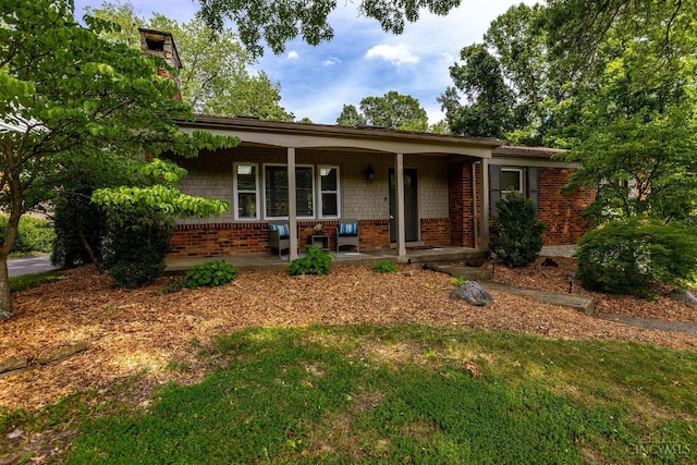 1050 Holz Ave, Anderson Twp, OH 45230 - ranch-style house featuring a porch and brick siding