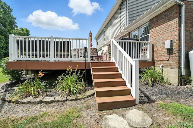 4961 Troubador Ct, Delhi Twp, OH 45238 - view of side of property with brick siding, a deck, and stairway