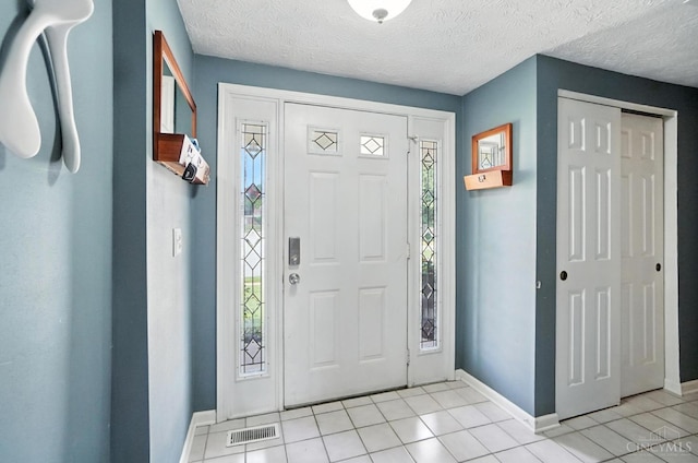 4961 Troubador Ct, Delhi Twp, OH 45238 - entryway featuring plenty of natural light and light tile patterned flooring