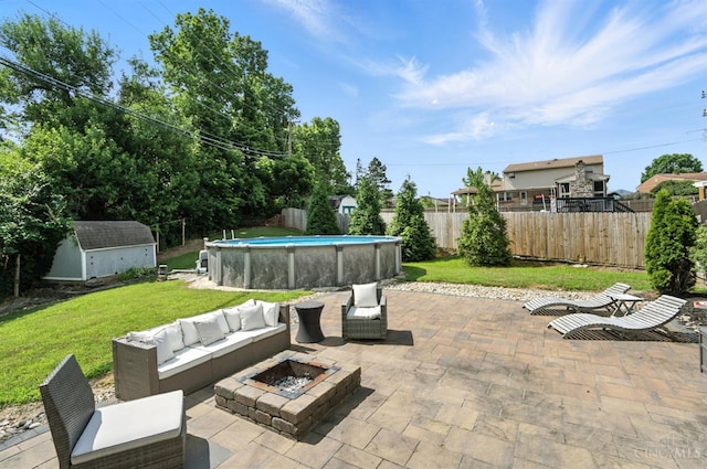 4961 Troubador Ct, Delhi Twp, OH 45238 - fenced backyard with a storage unit, a patio area, and an outdoor living space with a fire pit