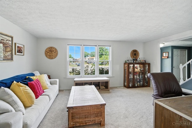 4961 Troubador Ct, Delhi Twp, OH 45238 - living room with light carpet, a textured ceiling, and stairway