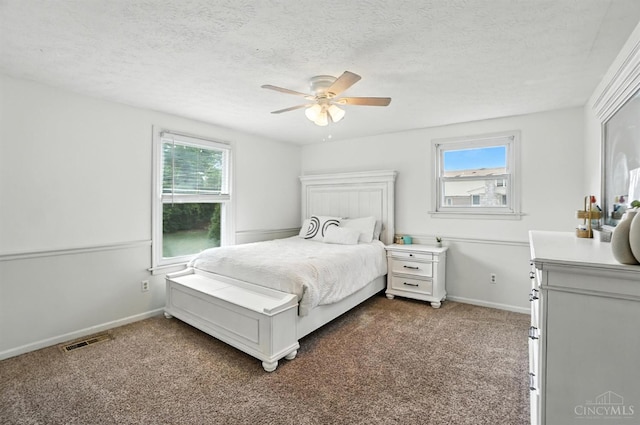 4961 Troubador Ct, Delhi Twp, OH 45238 - bedroom featuring multiple windows, carpet flooring, a textured ceiling, and a ceiling fan